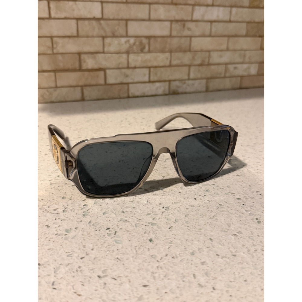 Versace VE4436U Sunglasses Transparent Grey Frame Dark Gray Lenses Medusa Gold